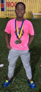 Kione Deshong with two medals